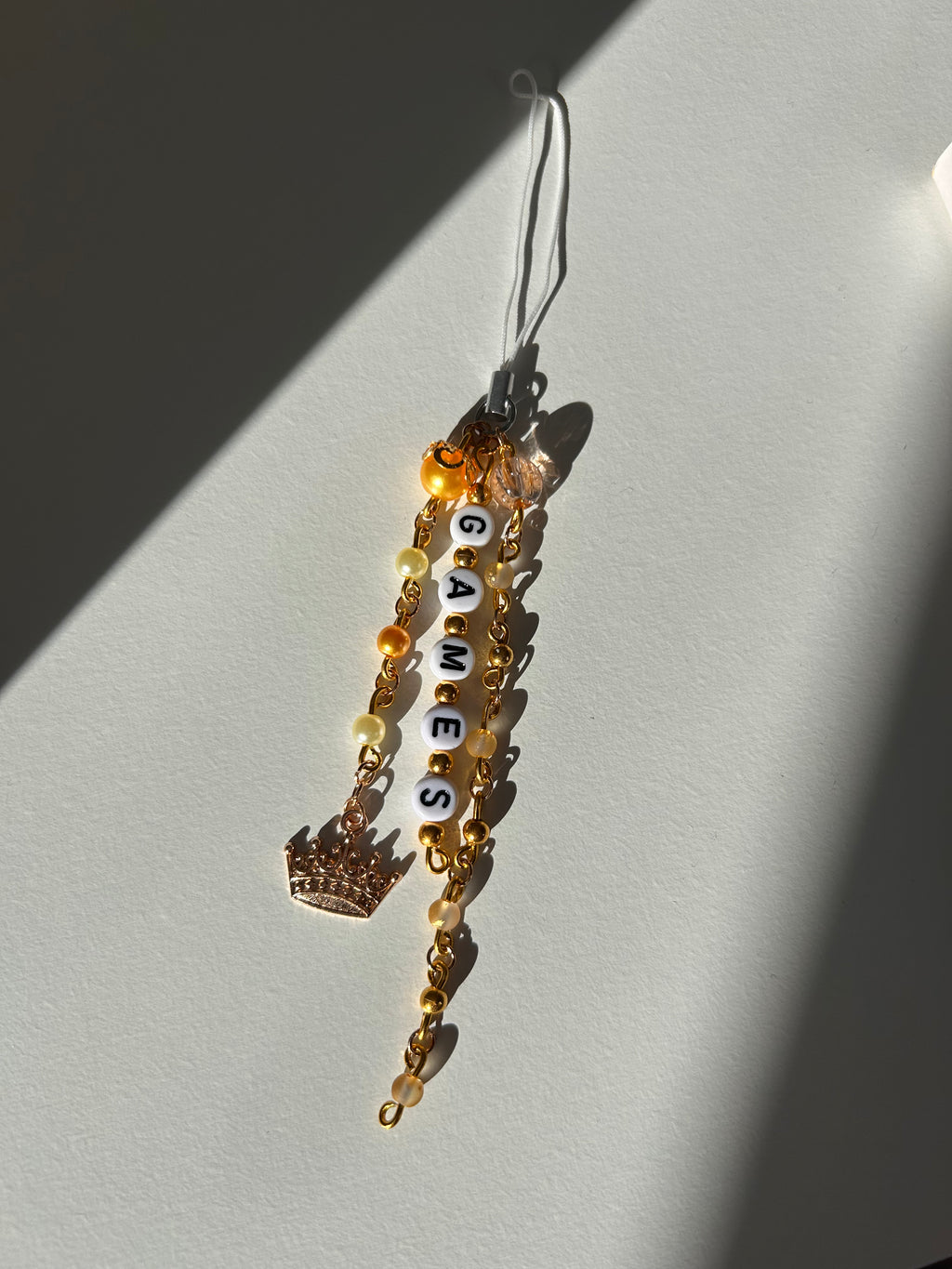 Twisted Games Charm Sling