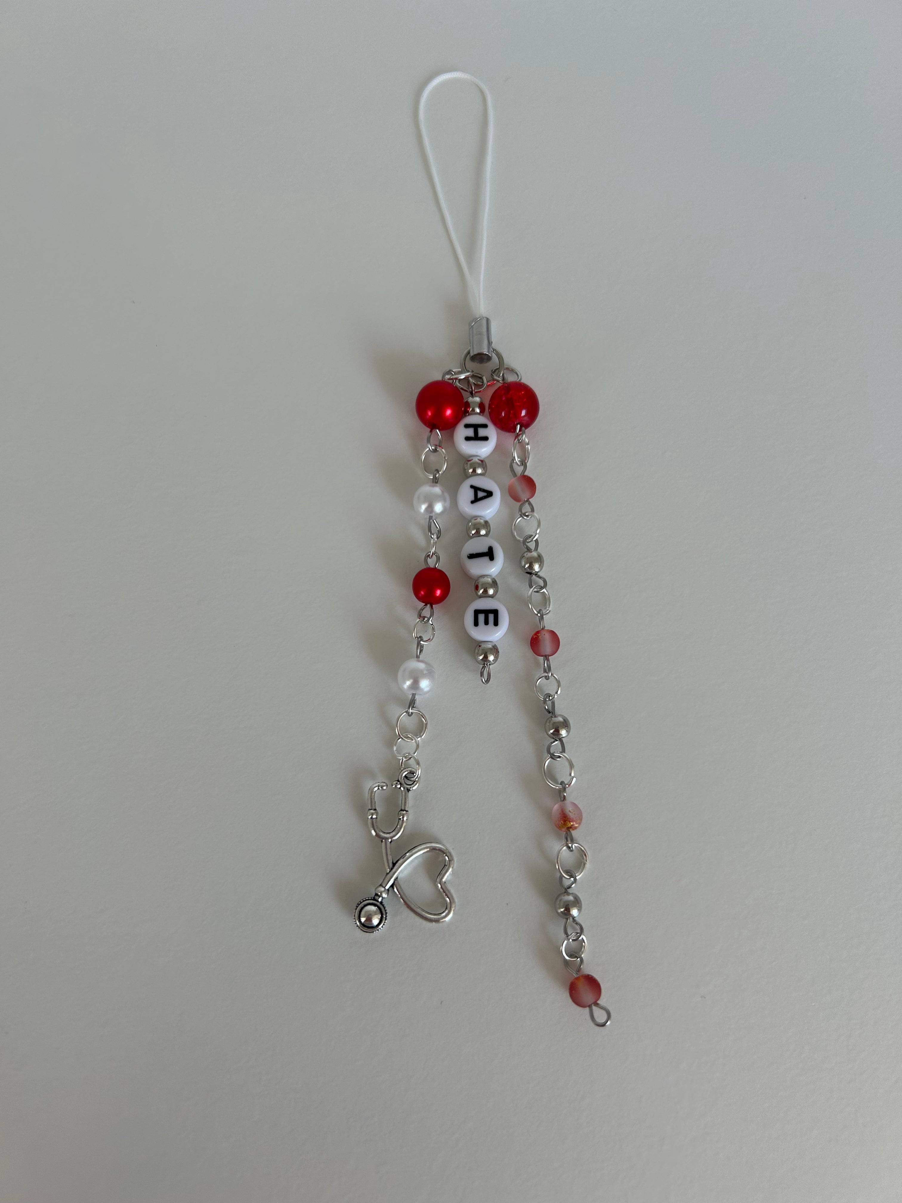 Twisted Hate Charm Sling